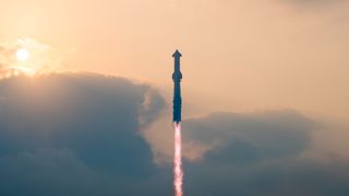 a huge rocket rises with a cloudy sky behind it